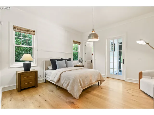 a bedroom with bed and window