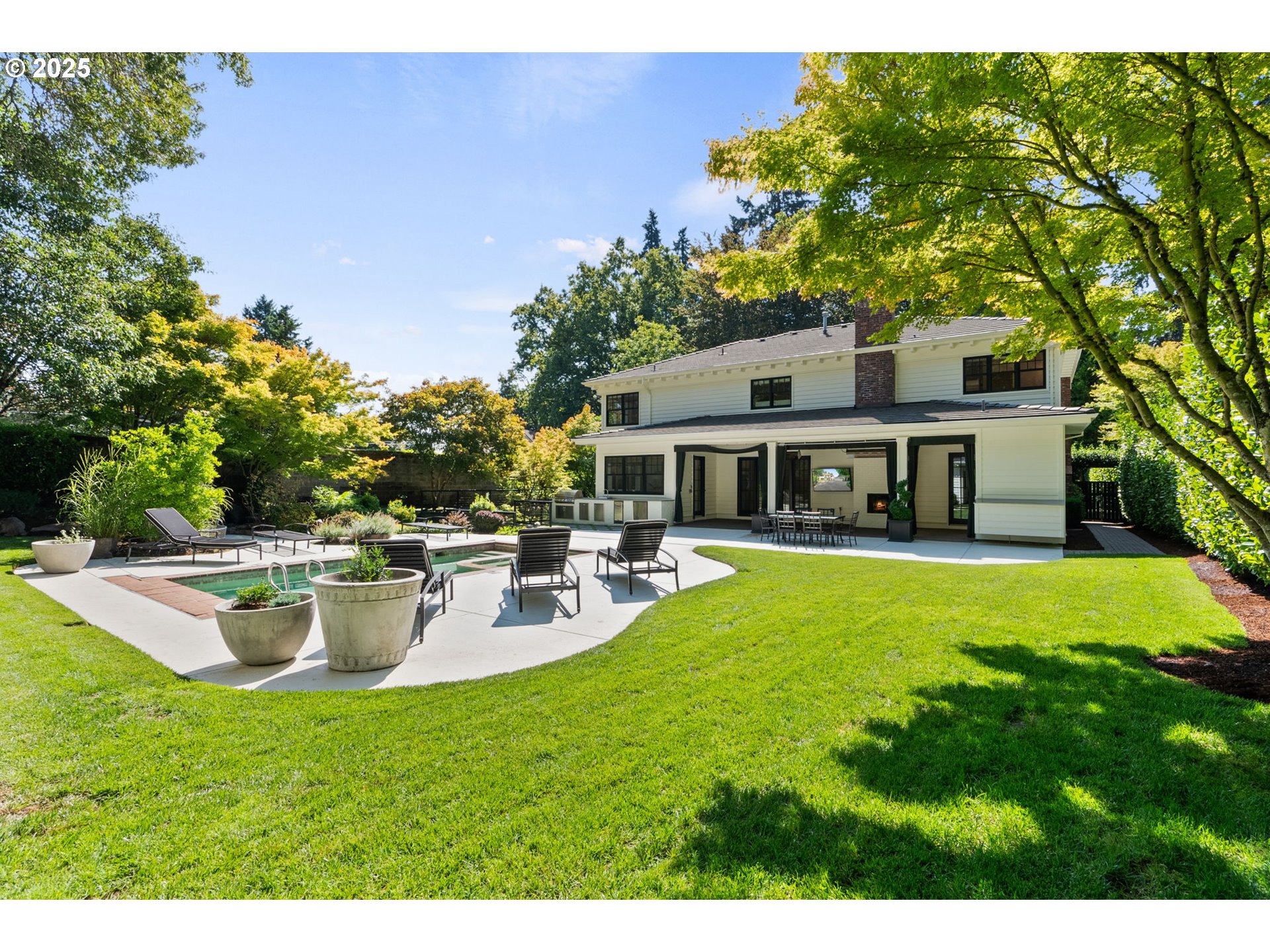 1819 South Radcliffe Road Portland, OR 97219 - Photo 3 of 48 a view of a house with backyard sitting area and garden