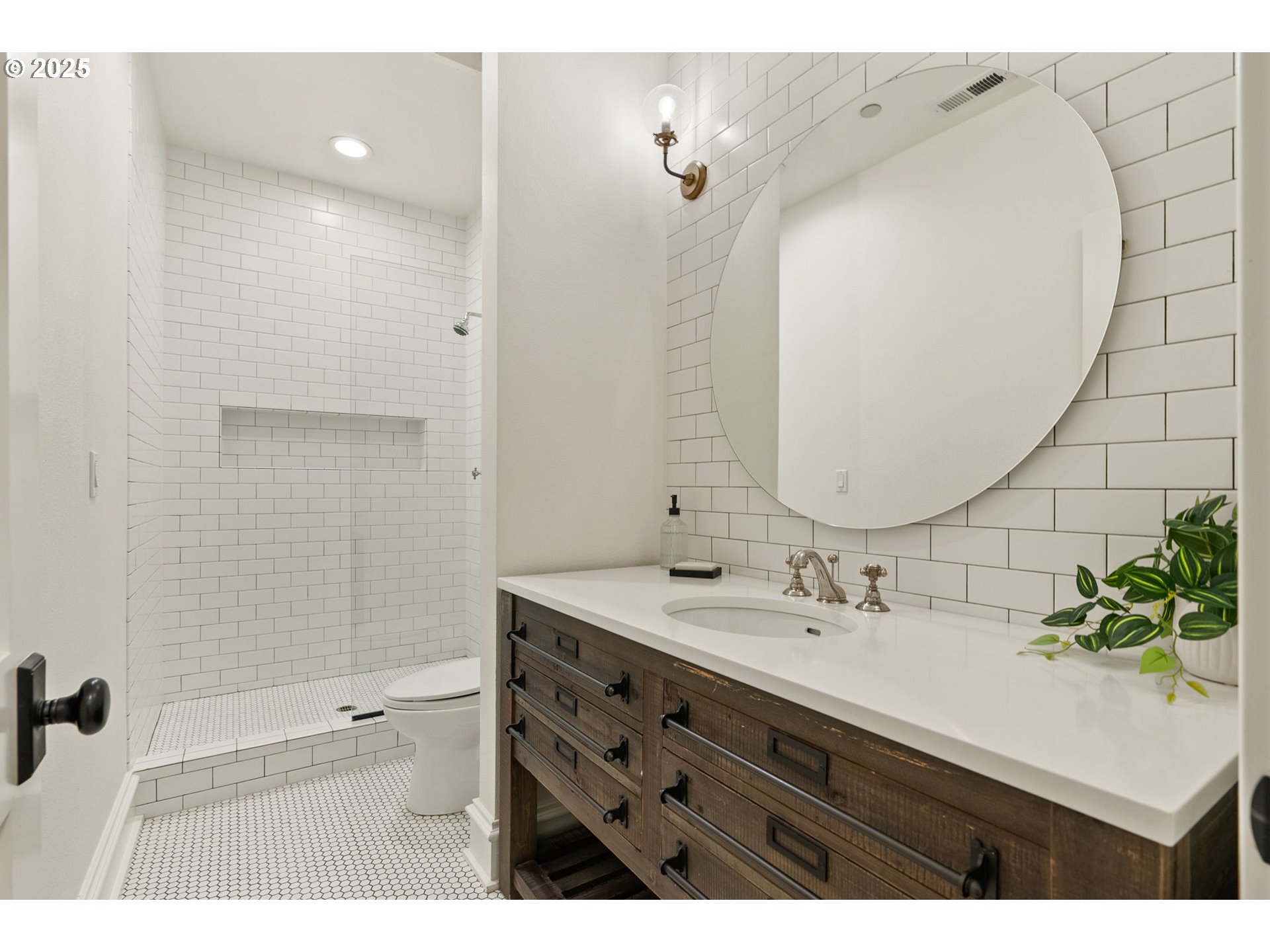 1819 South Radcliffe Road Portland, OR 97219 - Photo 32 of 48 a bathroom with a sink mirror and a shower