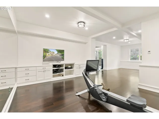 a view of a livingroom with furniture and a flat screen tv