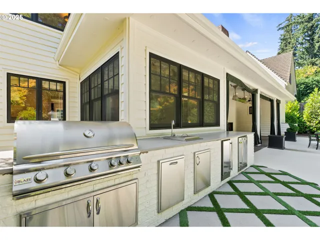 a kitchen with a stove and a sink