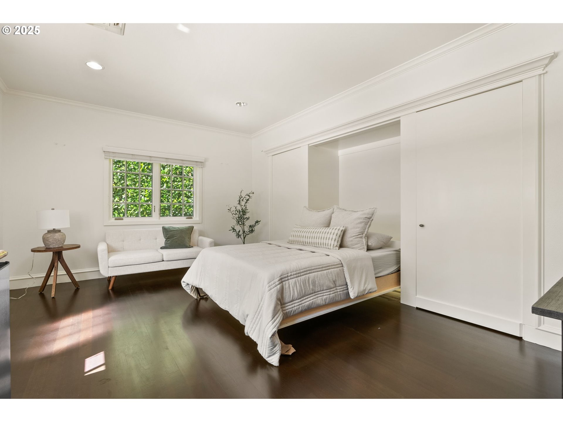 1819 South Radcliffe Road Portland, OR 97219 - Photo 44 of 48 a bedroom with a large bed and a wooden floor