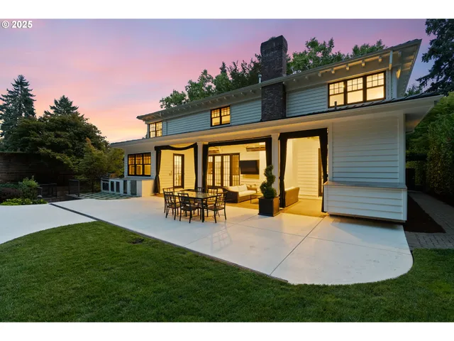 a view of a house with patio and a yard