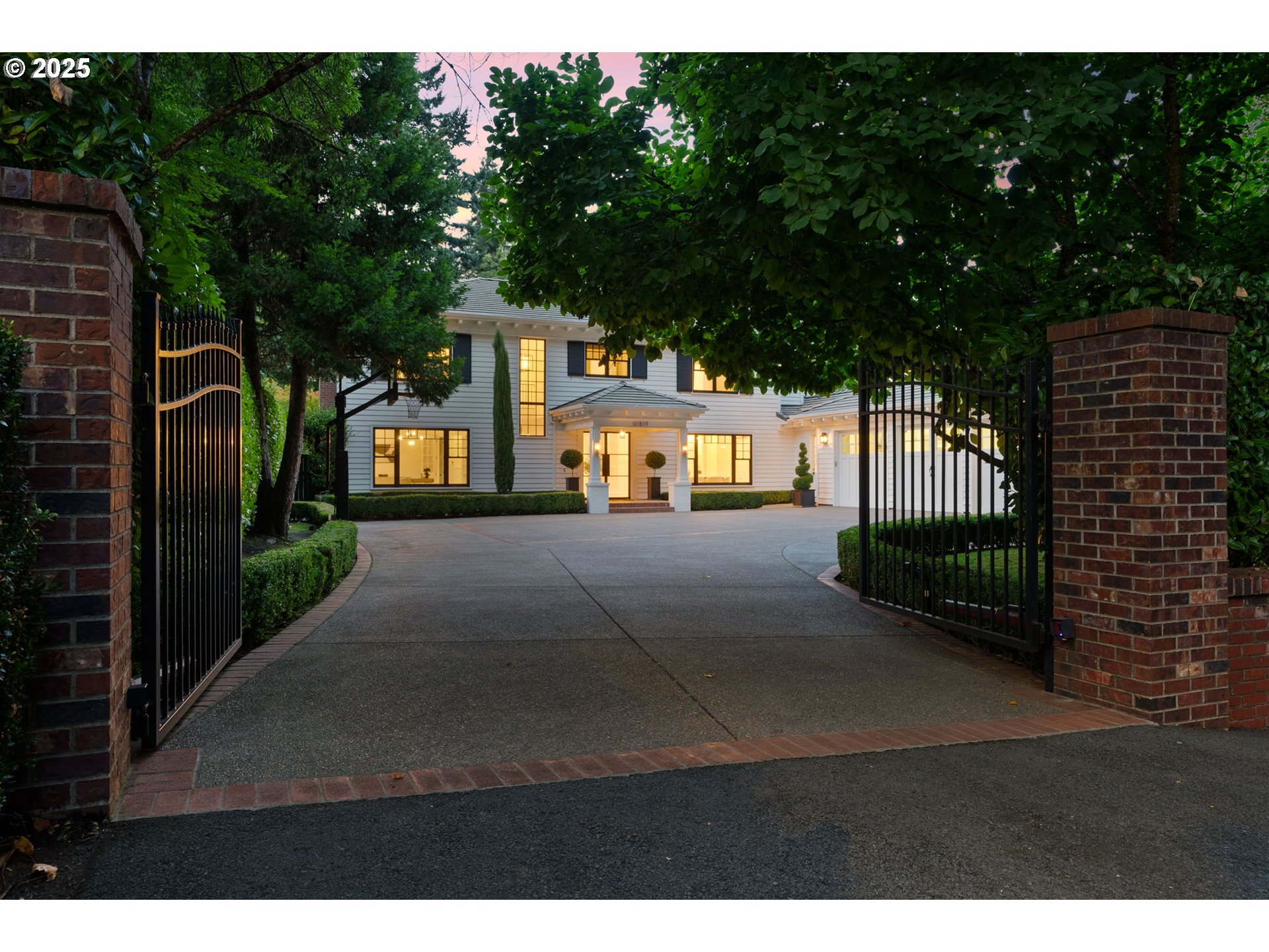 1819 South Radcliffe Road Portland, OR 97219 - Photo 8 of 48 a view of a street with brick wall and potted plants