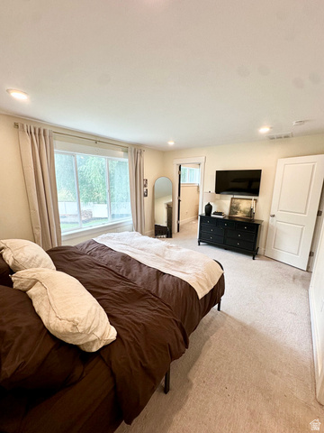 1148 290 South Logan, UT 84321 - Photo 18 of 34 Recessed lighting, light-toned carpeting, and a window with trim