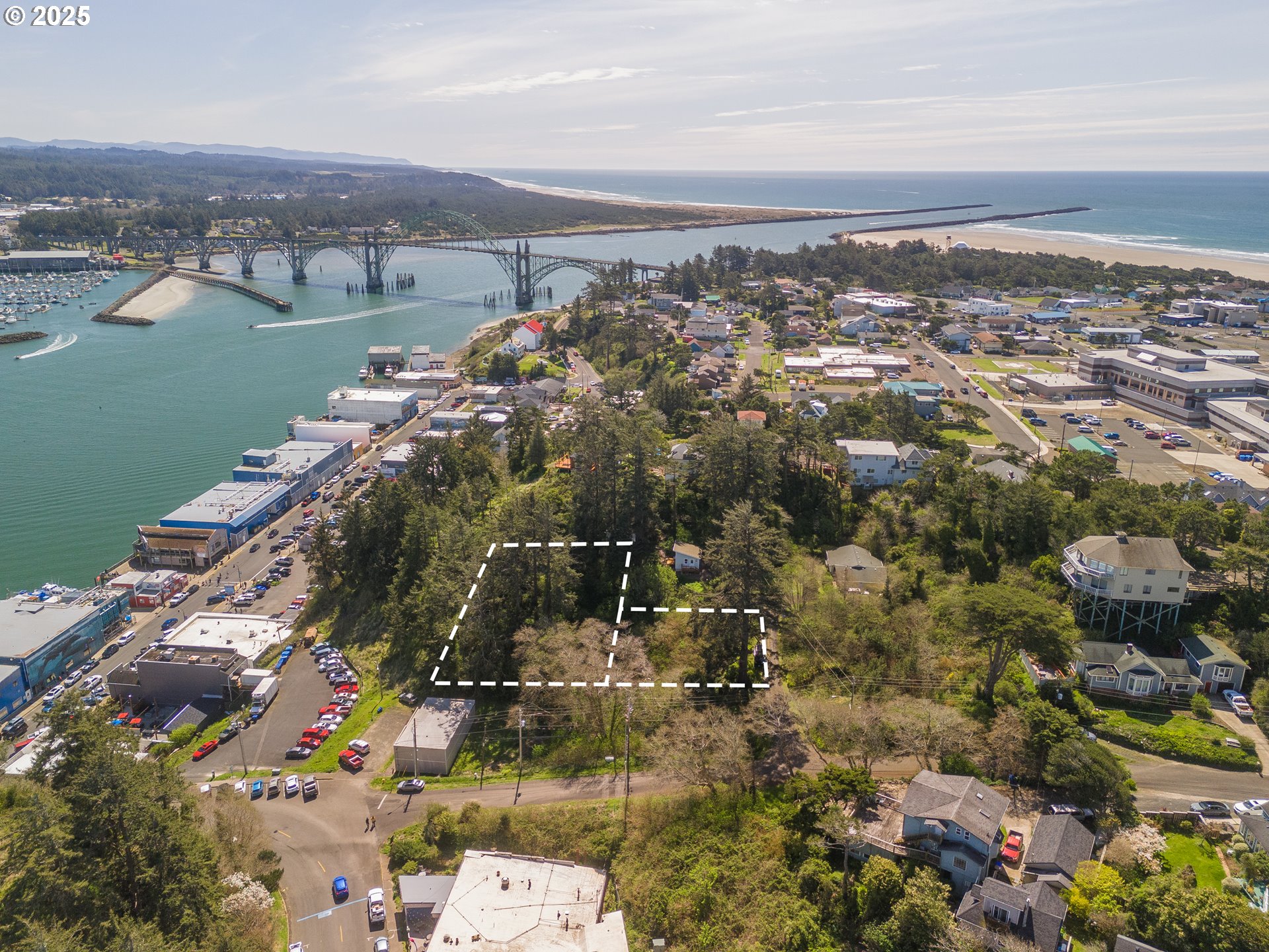5900 Southwest 12th Street Newport, OR 97365 - Photo 2 of 15 an aerial view of a city with mountains
