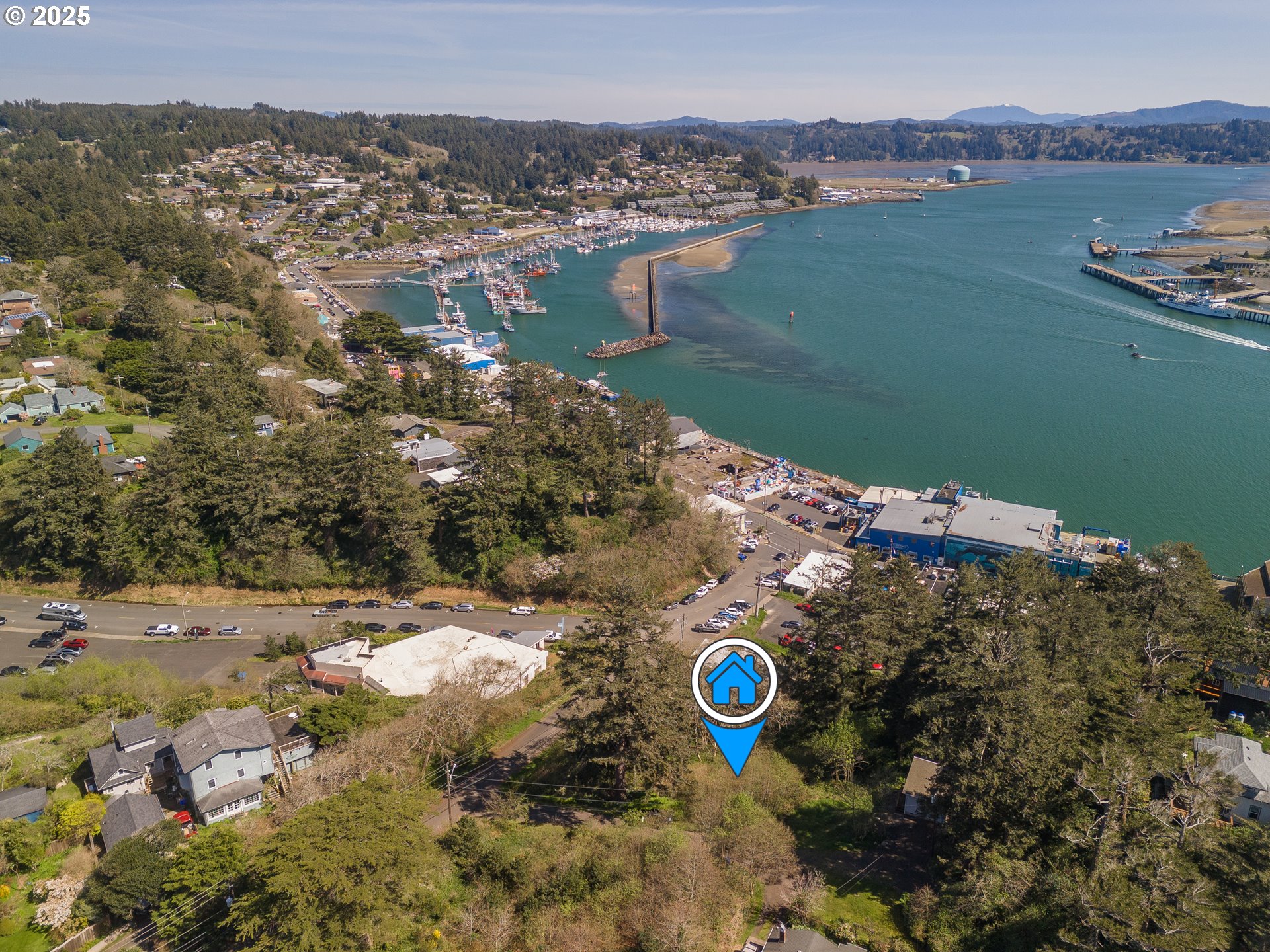 5900 Southwest 12th Street Newport, OR 97365 - Photo 3 of 15 a view of a lake with a mountain