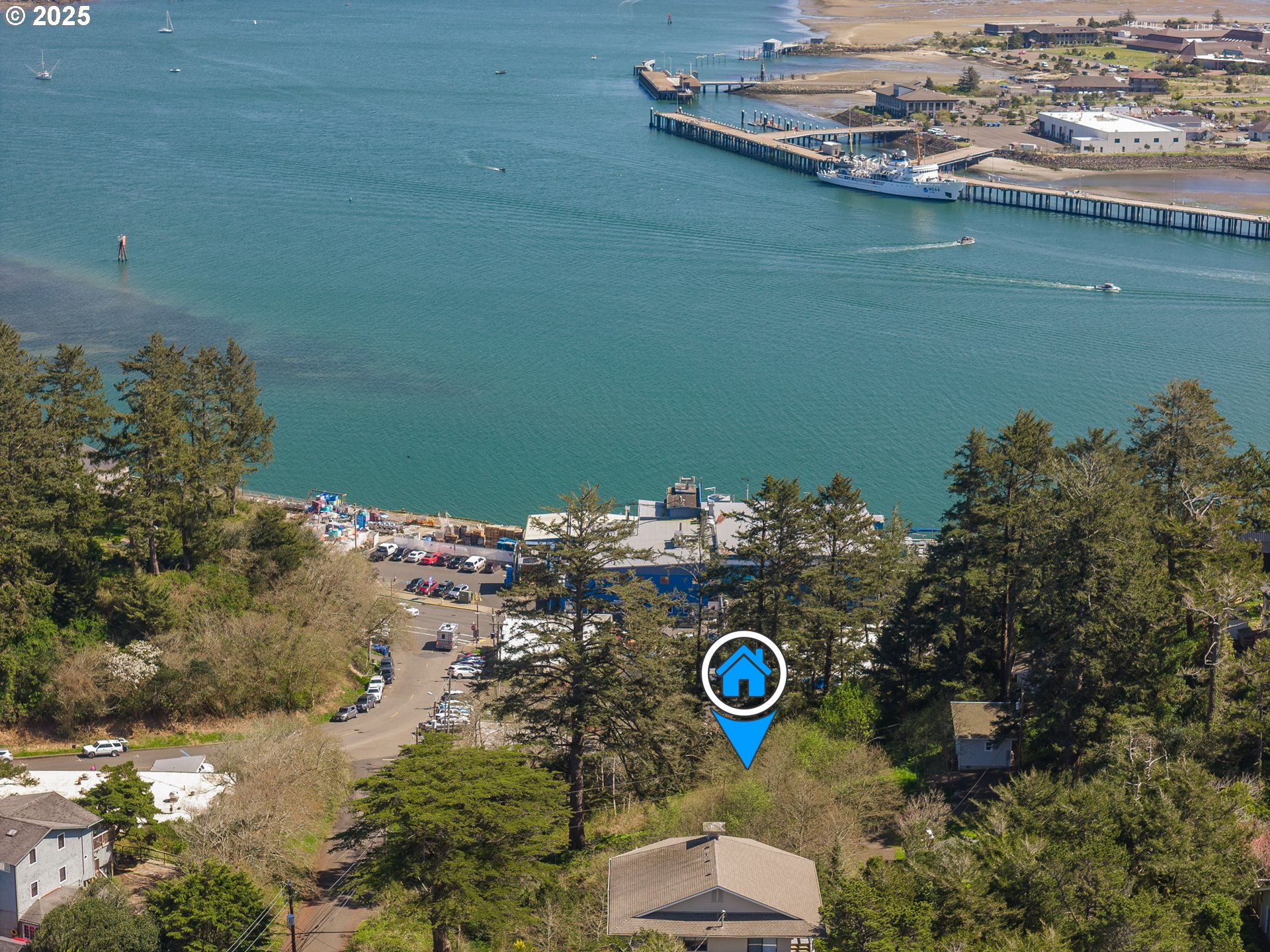 5900 Southwest 12th Street Newport, OR 97365 - Photo 7 of 15 a view of a lake with a house