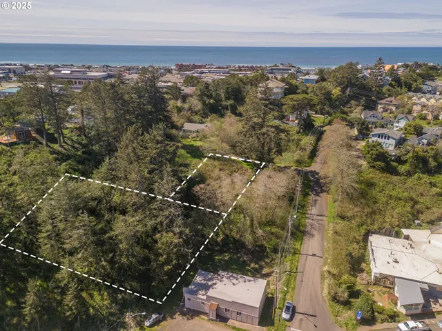 an aerial view of residential building with parking space