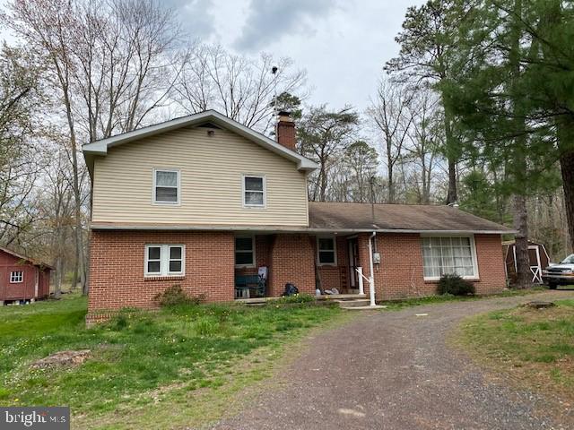 a front view of a house with yard