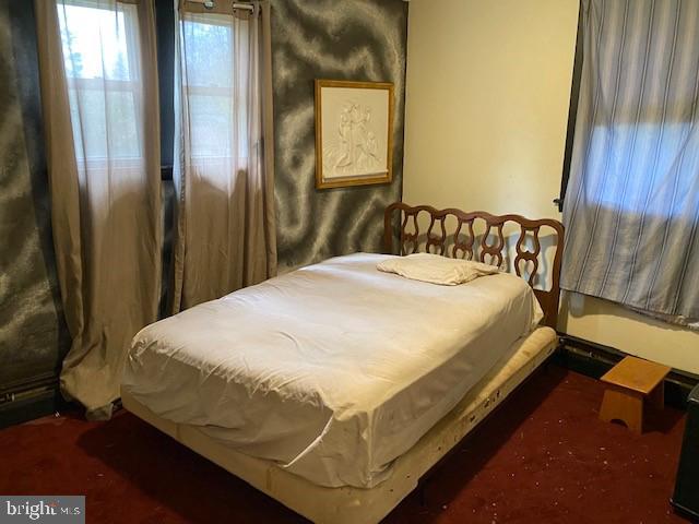 5152 Hiffletrayer Road Green Lane, PA 18054 - Photo 13 of 24 a bed sitting in a bedroom next to a wooden cabinet