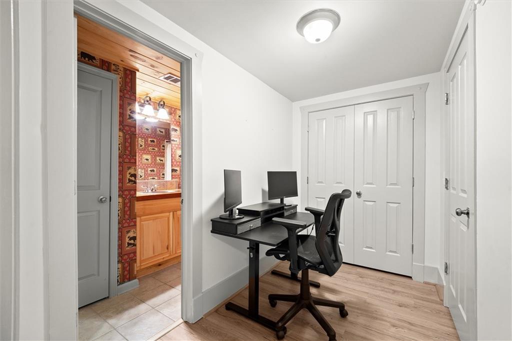 6229 Grand Loop Road Sugar Hill, GA 30518 - Photo 56 of 93 a view of a workspace with furniture and a window