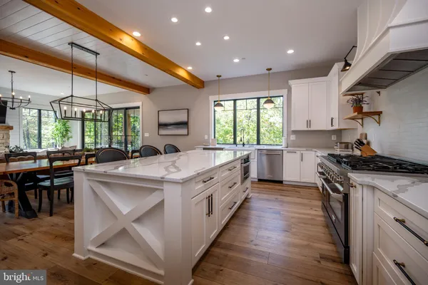 a living room with fireplace furniture and a flat screen tv