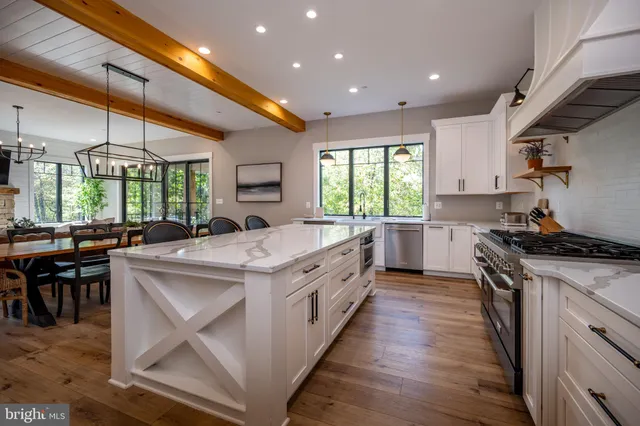 a living room with fireplace furniture and a flat screen tv