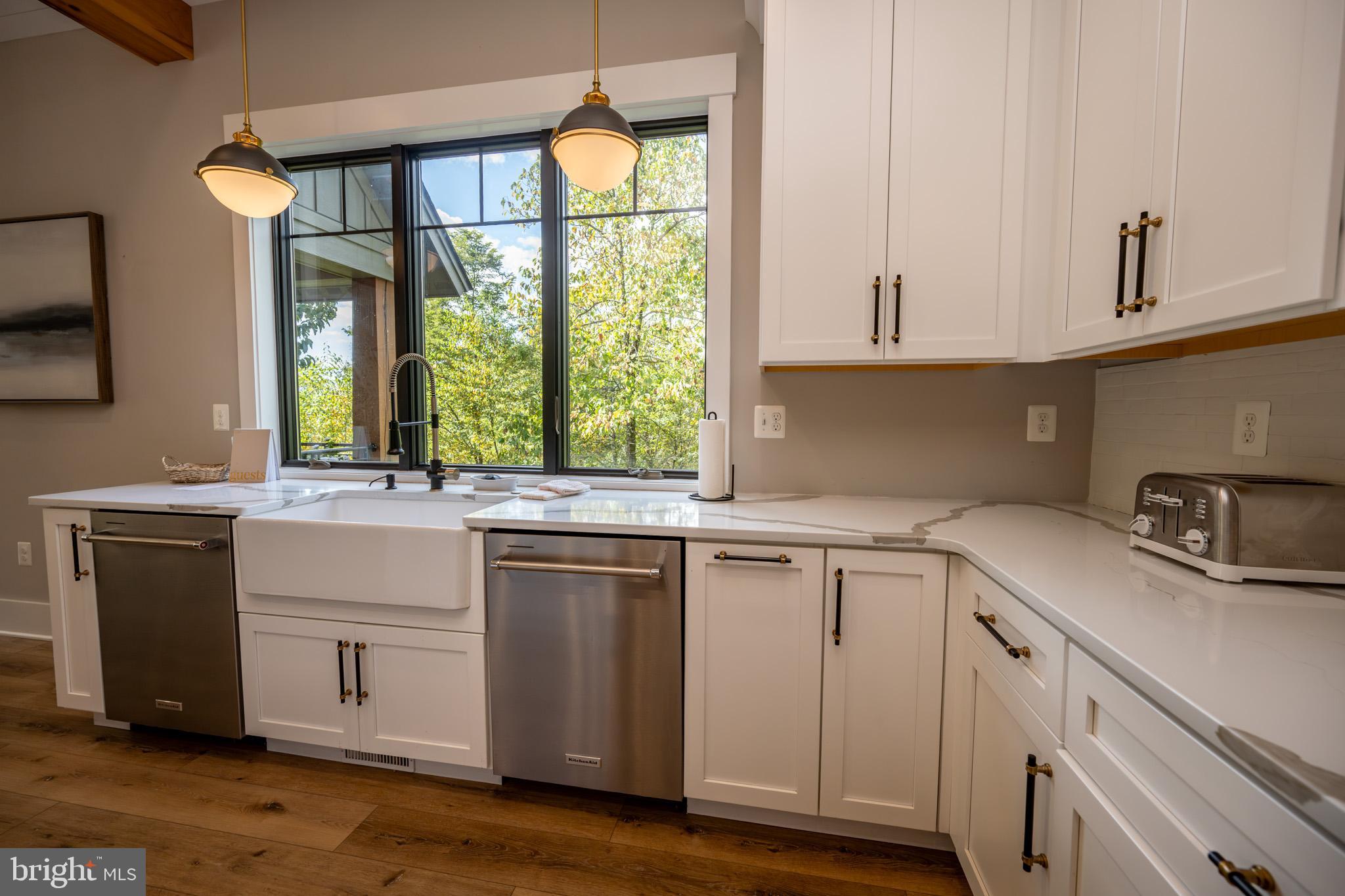 152 Ridge Run Road McHenry, MD 21541 - Photo 14 of 100 a kitchen with a sink cabinets and a window