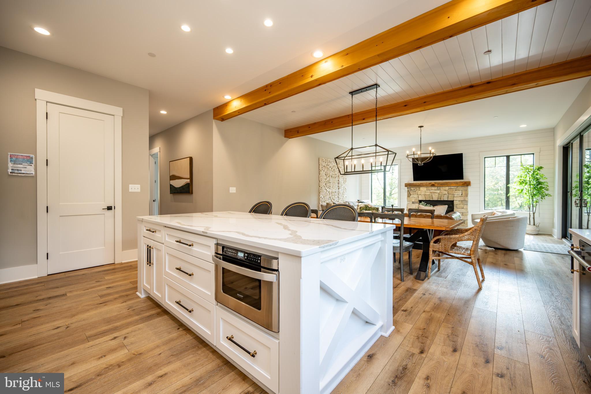 152 Ridge Run Road McHenry, MD 21541 - Photo 15 of 100 a kitchen with a stove and a wooden floor