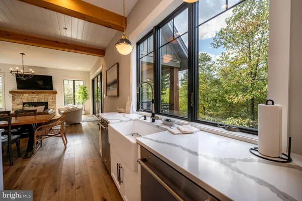 a view of staircase with wooden floor and a rug