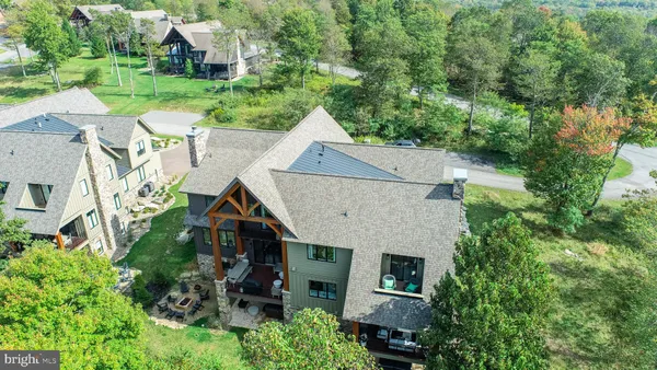 a view of house with yard and entertaining space