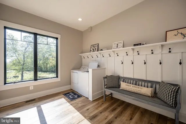a bathroom with a double vanity sink mirror double and shower