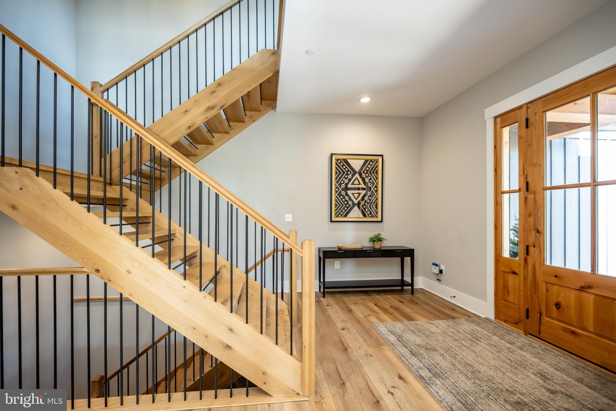 152 Ridge Run Road McHenry, MD 21541 - Photo 33 of 100 a view of staircase with wooden floor and a rug