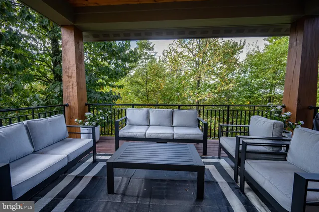 a bathroom with a double vanity sink toilet and mirror