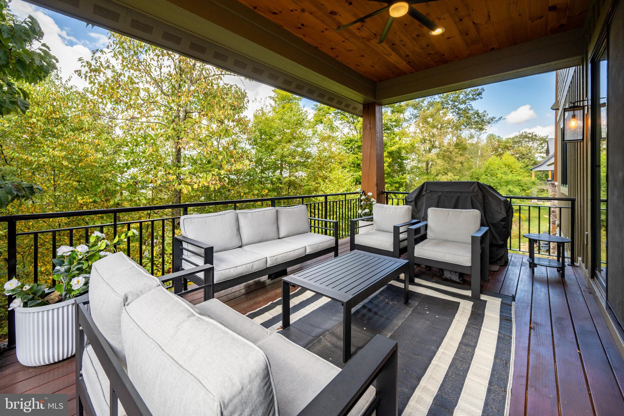 152 Ridge Run Road McHenry, MD 21541 - Photo 40 of 100 a balcony with wooden floor and outdoor seating