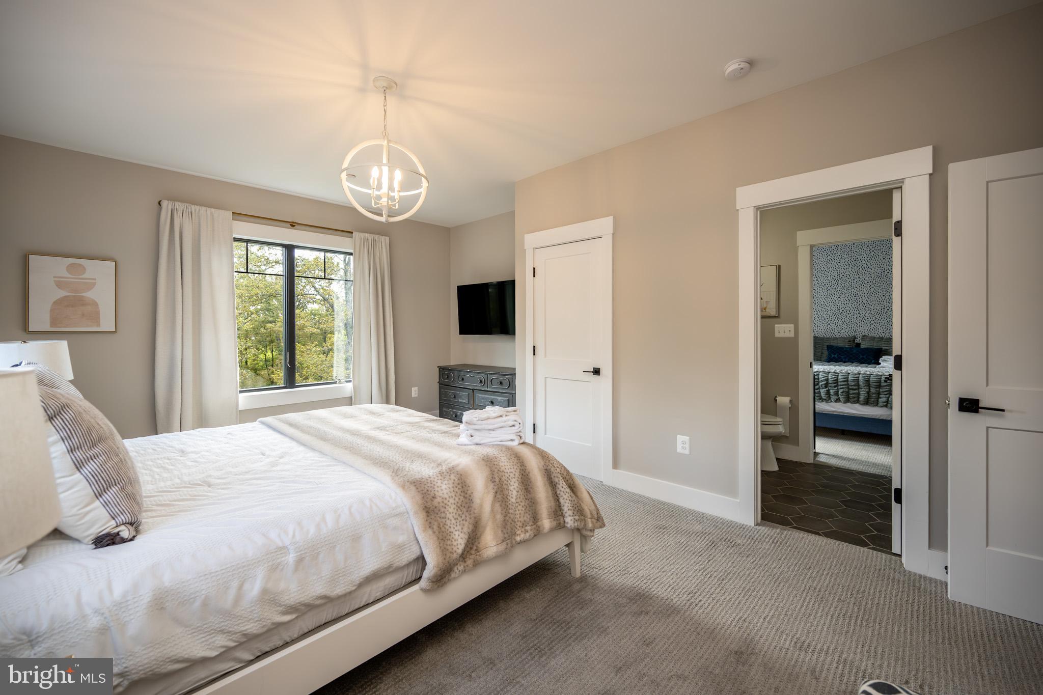 152 Ridge Run Road McHenry, MD 21541 - Photo 41 of 100 a bedroom with a bed and a window