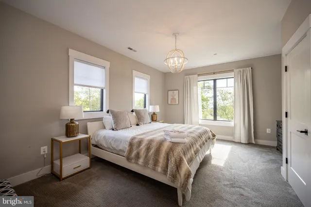 a living room with furniture fireplace and a flat screen tv