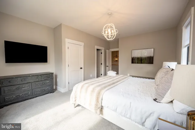 a view of a sitting area with furniture and wooden floor