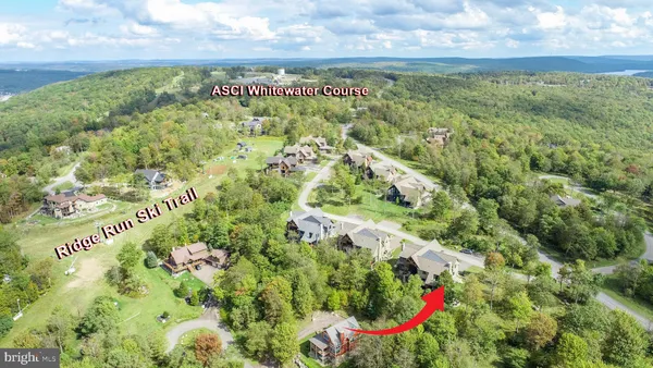 a kitchen with a stove a sink and a microwave