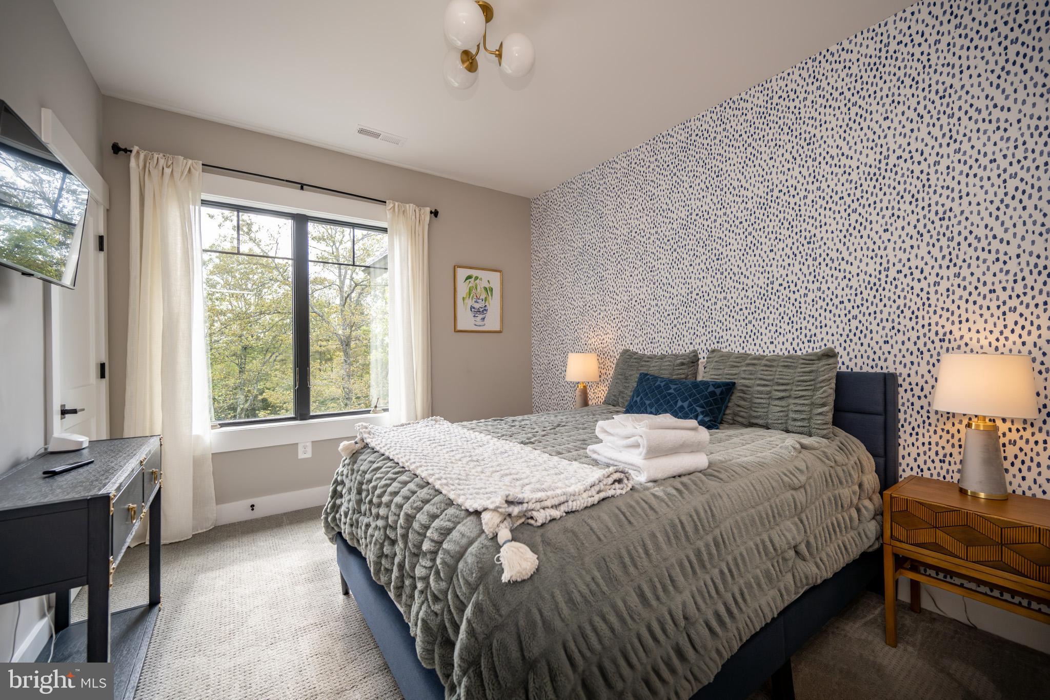 152 Ridge Run Road McHenry, MD 21541 - Photo 51 of 100 a bedroom with a bed and a lamp with window