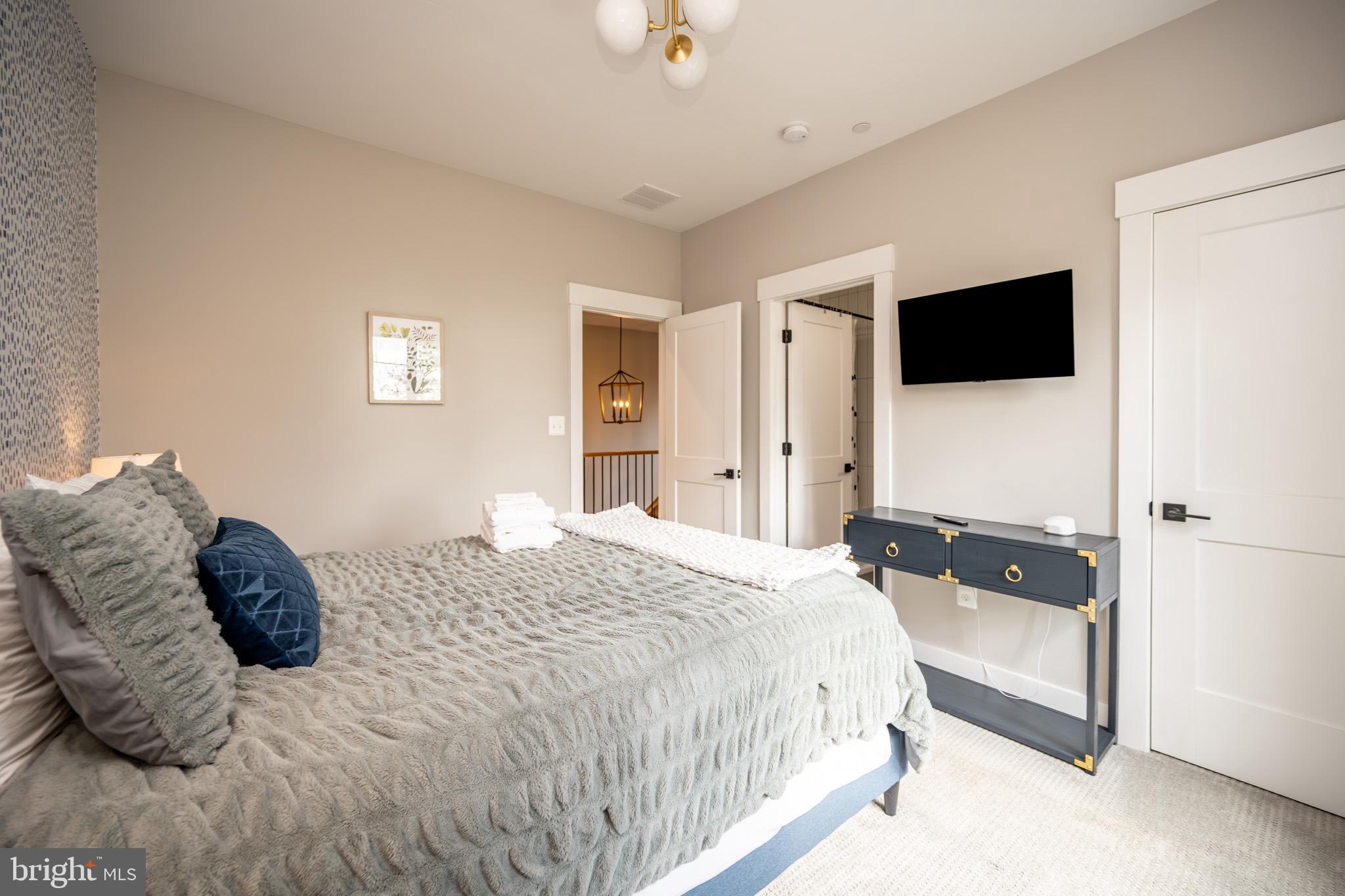 152 Ridge Run Road McHenry, MD 21541 - Photo 54 of 100 a bedroom with a bed and a television