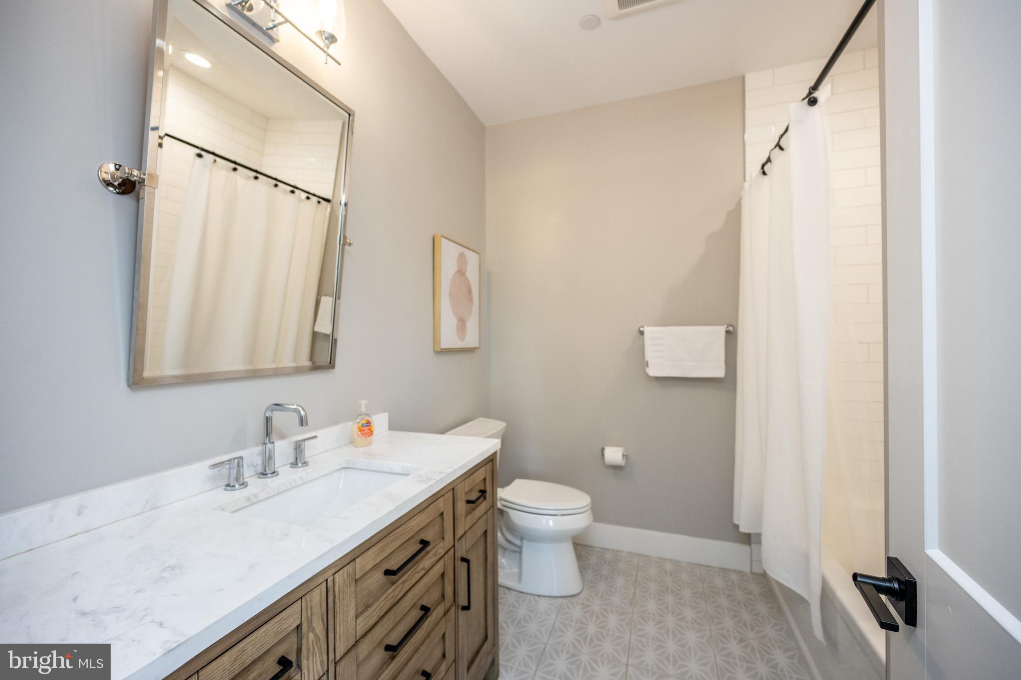 152 Ridge Run Road McHenry, MD 21541 - Photo 73 of 100 a bathroom with a granite countertop sink toilet and shower