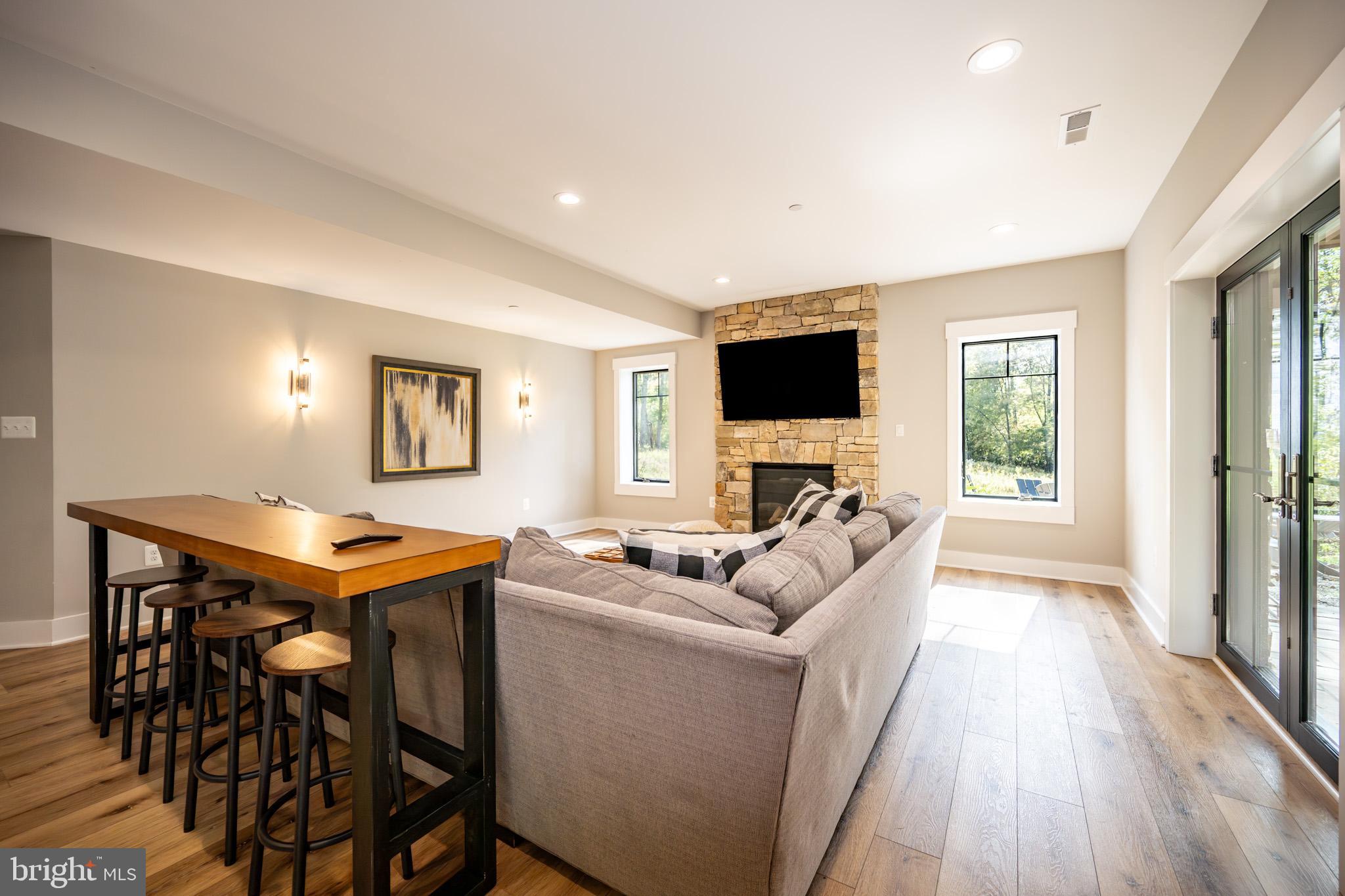 152 Ridge Run Road McHenry, MD 21541 - Photo 85 of 100 a living room with furniture a flat screen tv and a window