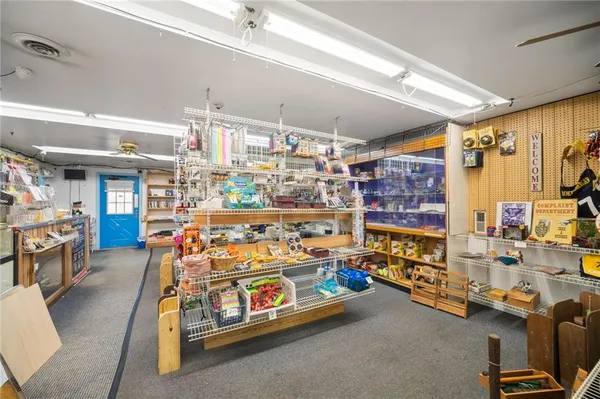 a room with furniture a rug and a window