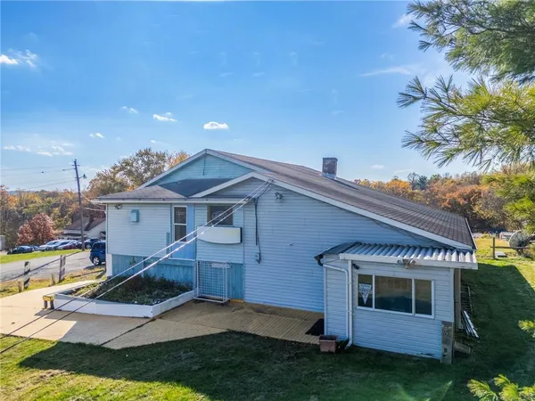 a view of house and yard with swimming pool