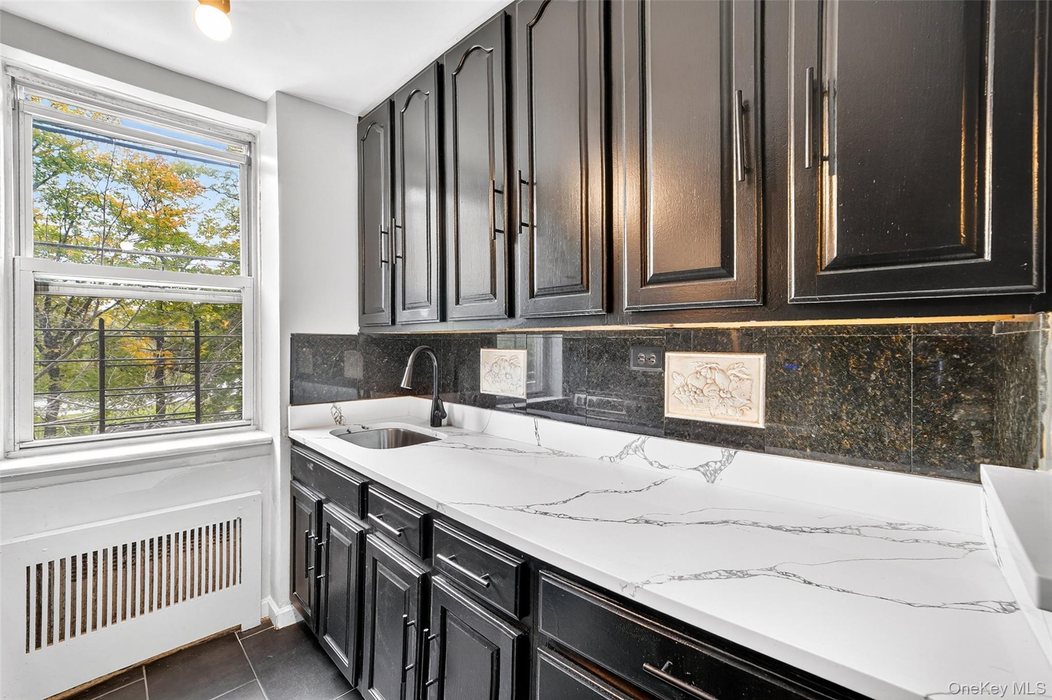 4295 Webster Avenue, Unit 1D Bronx, NY 10470 - Photo 12 of 21 a kitchen with a sink and a window