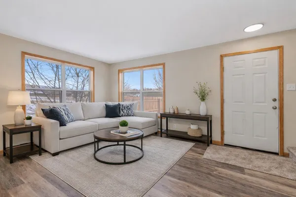 a living room with furniture and a window