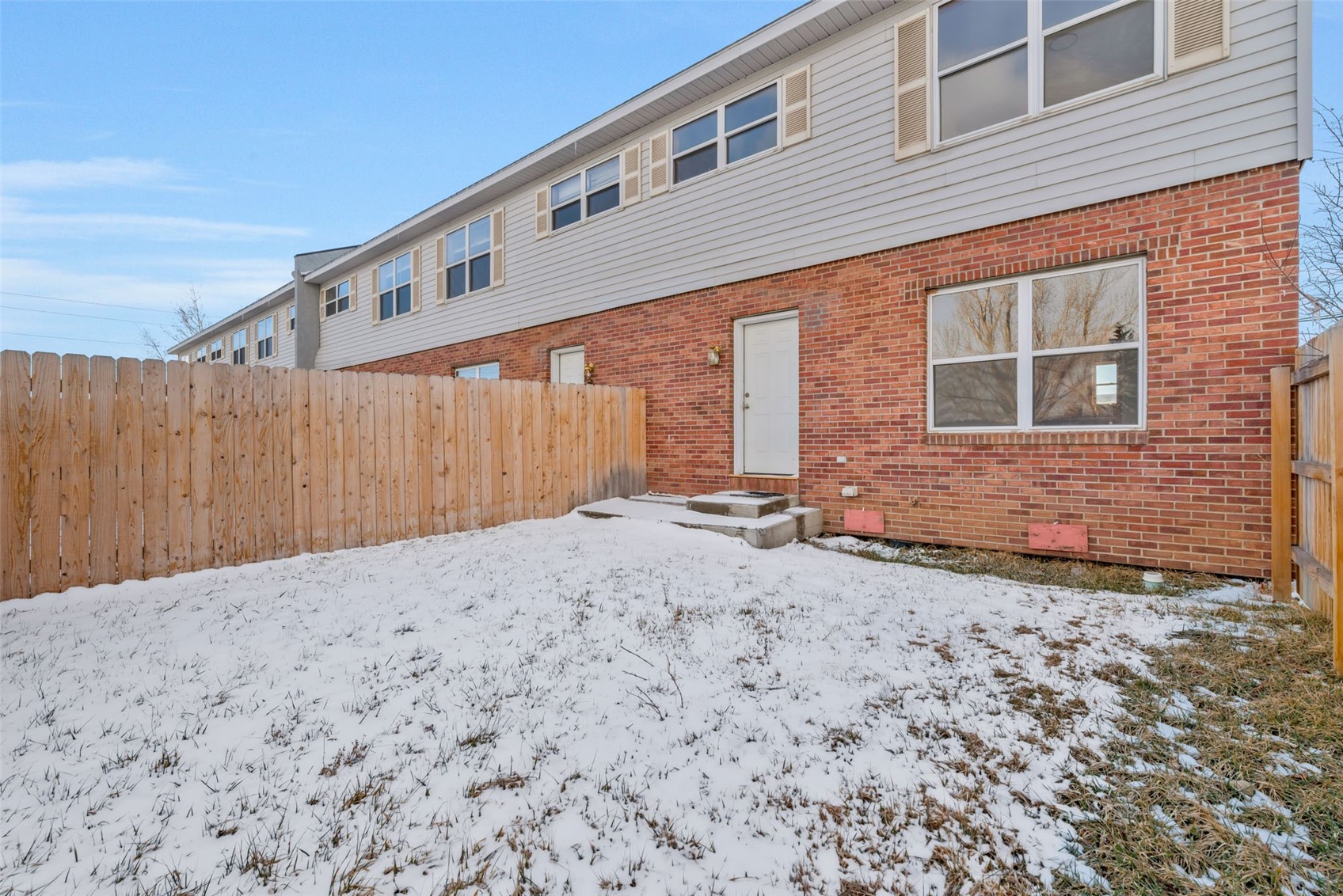 401 South 3rd Street, Unit 401 Hayden, CO 81639 - Photo 14 of 38 a backyard of a house with wooden fence