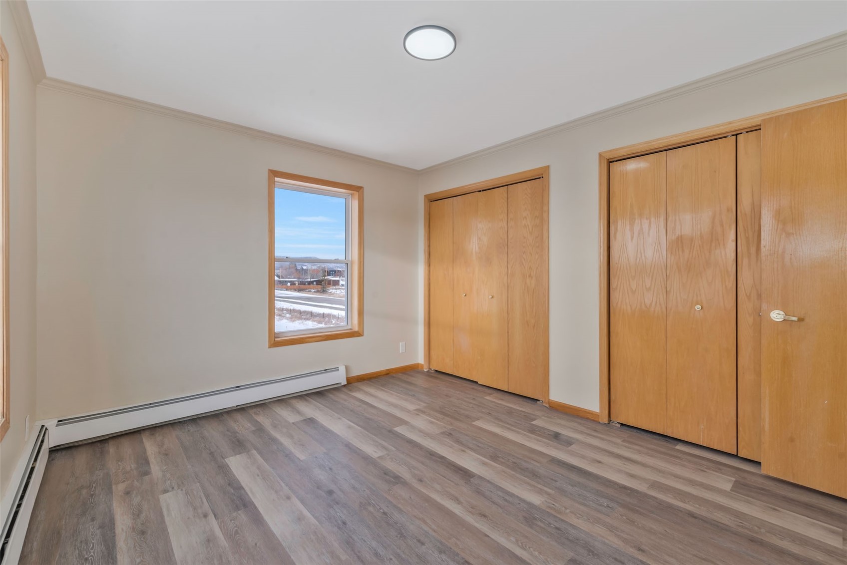 401 South 3rd Street, Unit 401 Hayden, CO 81639 - Photo 23 of 38 a view of an empty room with wooden floor and a window