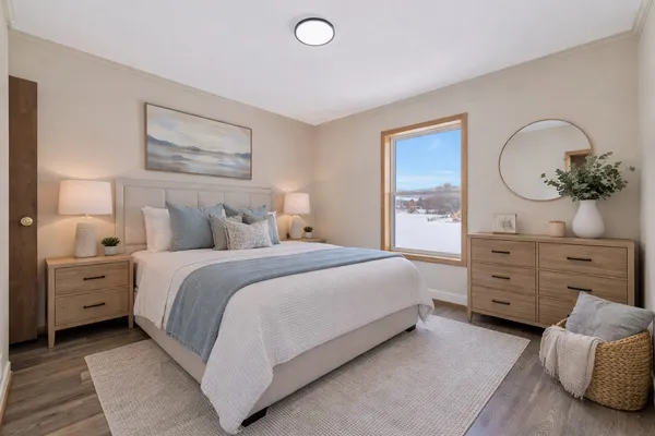 a bedroom with a bed and a dresser