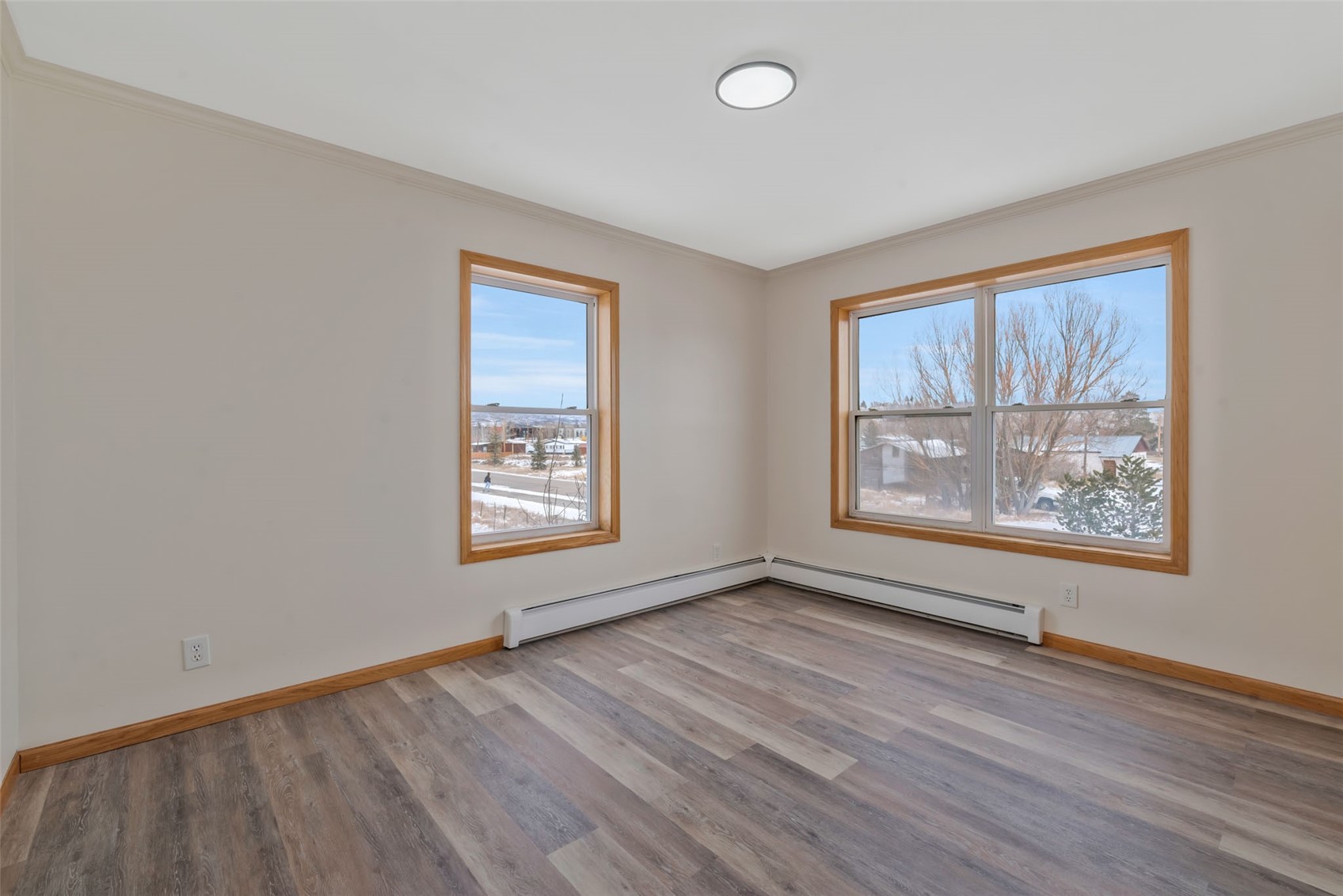 401 South 3rd Street, Unit 401 Hayden, CO 81639 - Photo 28 of 38 an empty room with wooden floor and windows