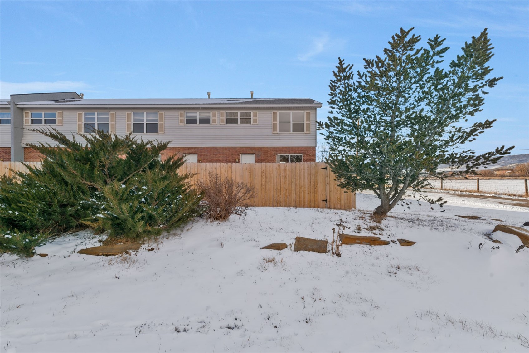 401 South 3rd Street, Unit 401 Hayden, CO 81639 - Photo 30 of 38 a view of backyard with a table and chair under an umbrella