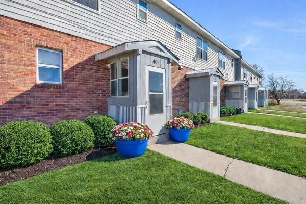 a front view of a house with a yard