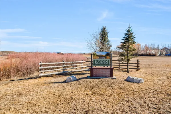 a view of a road with a building in the background