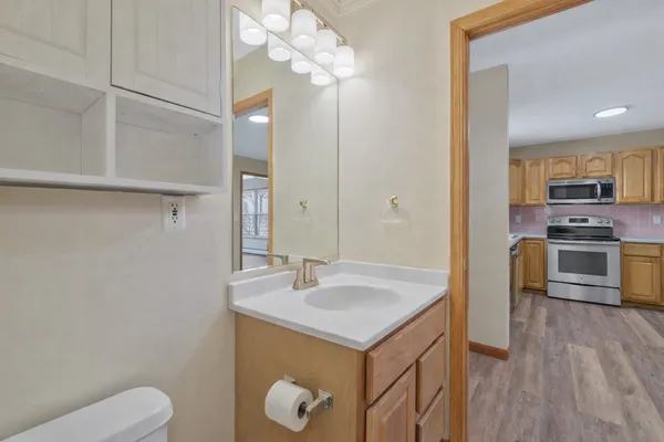 a kitchen with a sink and a refrigerator