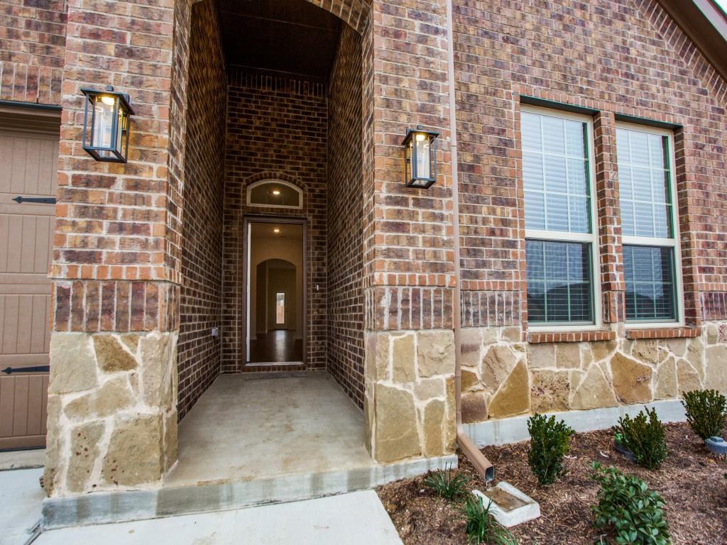 123 Lakeview Circle Pilot Point, TX 76258 - Photo 5 of 39 a view of a brick house with an outdoor space