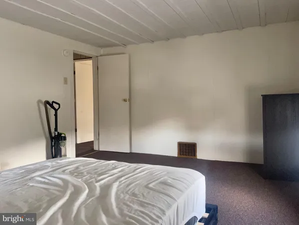 an empty room with closet area