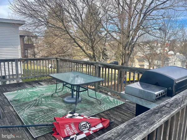 a view of a deck with furniture