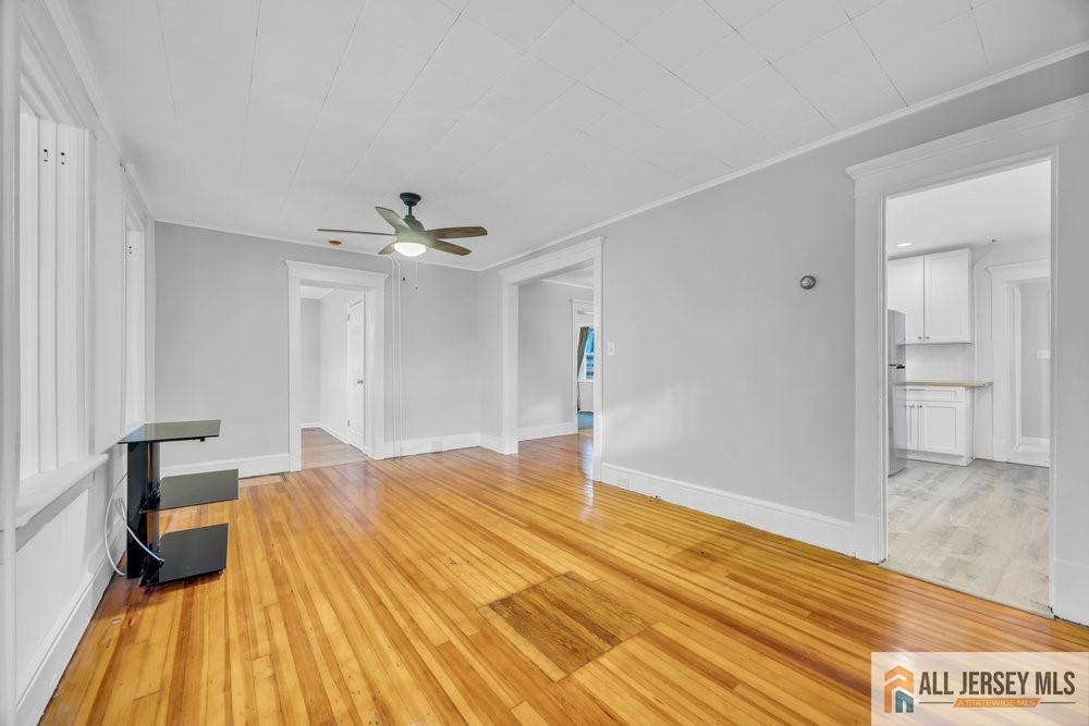 34 Maple Avenue Edison, NJ 08837 - Photo 3 of 20 a bedroom with a bed and a table